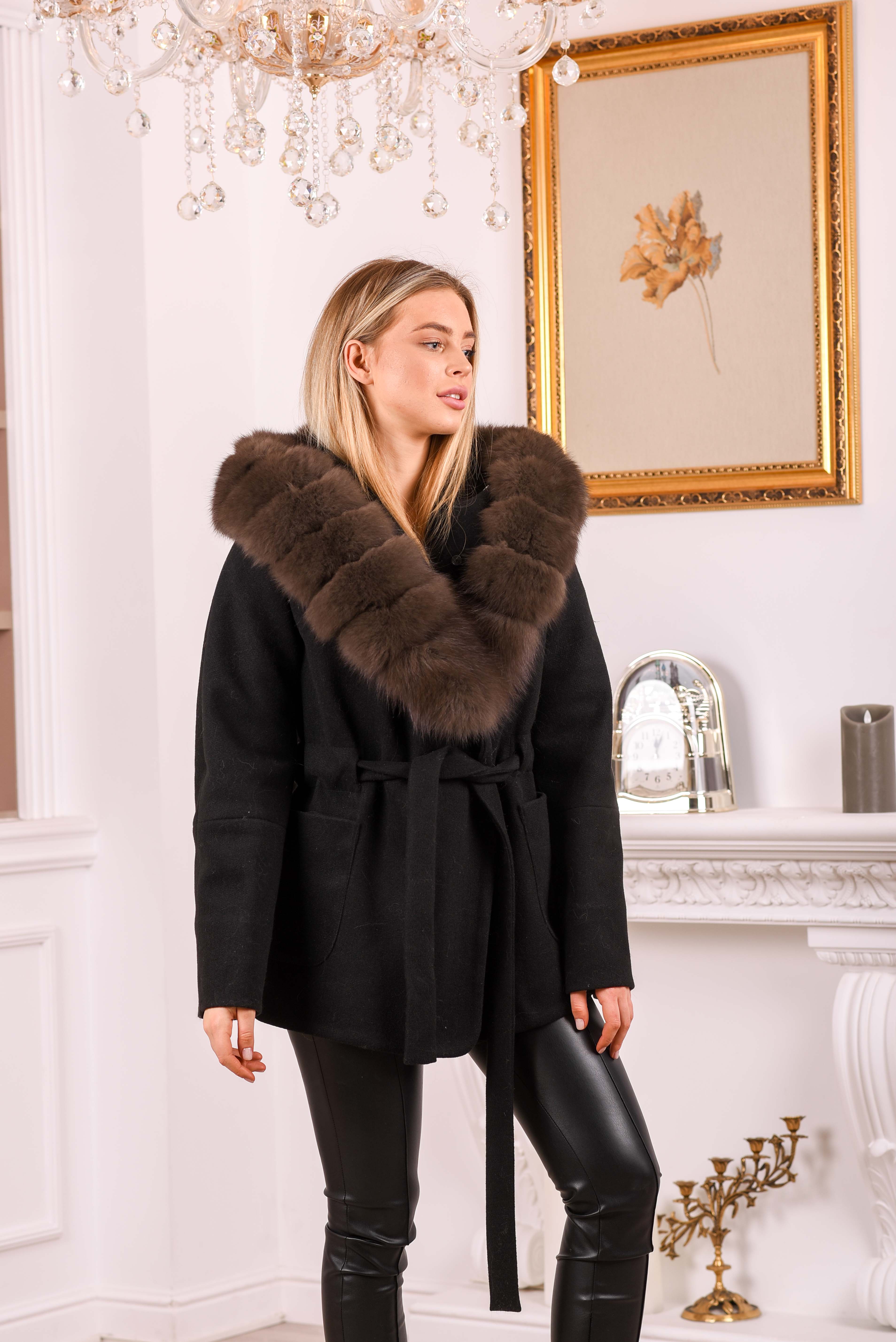 Fashionable women`s wool coat with fur hood