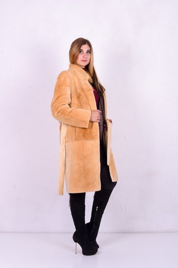 photographic Female fur coat of sand color under a muton in the women's fur clothing store https://furstore.shop
