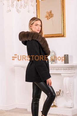photographic Fashionable women`s wool coat with fur hood in the women's fur clothing store https://furstore.shop